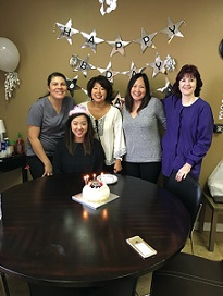 Dr. Ha and staff celebrating a birthday